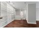 Bright living room, hardwood floors, built-in shelving and access to bathroom at 2479 Peachtree Rd # 101, Atlanta, GA 30324