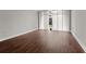 Large living room with hardwood floors and floor to ceiling windows at 2479 Peachtree Rd # 101, Atlanta, GA 30324