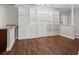 Spacious living area with hardwood floors and built-in shelving at 2479 Peachtree Rd # 101, Atlanta, GA 30324
