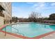 Inviting outdoor pool with brick deck and stairs at 2479 Peachtree Rd # 101, Atlanta, GA 30324