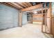 Unfinished basement with exposed block walls and garage access at 4147 Azalea Ct, Snellville, GA 30039