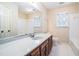 Bathroom with wood vanity, tile flooring, and a bathtub at 4147 Azalea Ct, Snellville, GA 30039