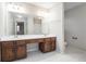 Bathroom with double vanity, tile flooring, and a large mirror at 4147 Azalea Ct, Snellville, GA 30039