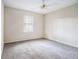 Spacious bedroom with neutral walls and carpet flooring at 4147 Azalea Ct, Snellville, GA 30039