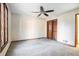 Bright bedroom with carpet flooring and ceiling fan at 4147 Azalea Ct, Snellville, GA 30039