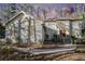 Two story house exterior, featuring a light colored stucco exterior, walkway and landscaping at 4147 Azalea Ct, Snellville, GA 30039