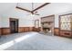 Living room with a brick fireplace, wood wall paneling, and carpet flooring at 4147 Azalea Ct, Snellville, GA 30039