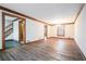 Spacious living room with hardwood floors, high ceilings and a view to the staircase at 4147 Azalea Ct, Snellville, GA 30039