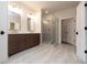 Bright bathroom with a double sink vanity and a glass-enclosed shower and tile floors at 502 Winston Croft Cir # 53, Johns Creek, GA 30022