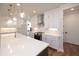 Bright kitchen features quartz countertops, stainless steel appliances, and modern lighting at 502 Winston Croft Cir # 53, Johns Creek, GA 30022
