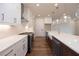 Modern kitchen featuring white cabinets, stainless steel appliances, and a center island with a farmhouse sink at 502 Winston Croft Cir # 53, Johns Creek, GA 30022