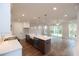A spacious kitchen boasts a center island with white countertops and modern globe pendant lights at 502 Winston Croft Cir # 53, Johns Creek, GA 30022