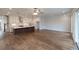 Open floorplan showing kitchen and living area with hardwood floors and recessed lighting at 502 Winston Croft Cir # 53, Johns Creek, GA 30022