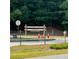 Sign for 'State Bridge Crossing Elementary,' set on a grassy lawn by the street at 502 Winston Croft Cir # 53, Johns Creek, GA 30022