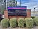 Electronic sign for 'State Bridge Crossing Elementary,' with brick base and shrubbery at 502 Winston Croft Cir # 53, Johns Creek, GA 30022