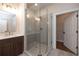Spacious glass shower is featured in this bathroom with double vanity at 502 Winston Croft Cir # 53, Johns Creek, GA 30022
