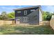 Back exterior view of the home featuring a fenced yard and wooden deck at 1432 Mims Sw St, Atlanta, GA 30314
