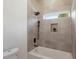 Bathroom with a shower/tub combo and gray tile at 1432 Mims Sw St, Atlanta, GA 30314