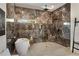 Luxury bathroom featuring a large format marble shower and soaking tub at 1432 Mims Sw St, Atlanta, GA 30314