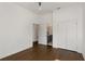 Light-filled bedroom with hardwood floors and en-suite bathroom at 1432 Mims Sw St, Atlanta, GA 30314