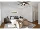 Main bedroom with hardwood floors, ceiling fan and stylish decor at 1432 Mims Sw St, Atlanta, GA 30314