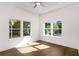 Spacious bedroom with hardwood floors and large windows at 1432 Mims Sw St, Atlanta, GA 30314