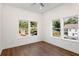 Bright bedroom with hardwood floors and multiple windows at 1432 Mims Sw St, Atlanta, GA 30314