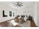 Main bedroom with hardwood floors, ceiling fan, and stylish decor at 1432 Mims Sw St, Atlanta, GA 30314