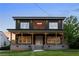 Inviting home with a classic front porch, showcasing a blend of brick and modern design elements at 1432 Mims Sw St, Atlanta, GA 30314