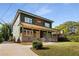 Two-story house with front porch and driveway at 1432 Mims Sw St, Atlanta, GA 30314