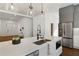 Modern kitchen island with white quartz countertop and stainless steel appliances at 1432 Mims Sw St, Atlanta, GA 30314