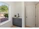 Modern wet bar with gray cabinets and quartz countertop at 1432 Mims Sw St, Atlanta, GA 30314