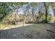 Spacious backyard with grassy area and mature trees at 1603 Hollyhock Ter, Decatur, GA 30032