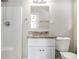 Clean bathroom with granite vanity and shower/tub combo at 1603 Hollyhock Ter, Decatur, GA 30032