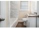 Clean bathroom with marble tile and granite countertop at 1603 Hollyhock Ter, Decatur, GA 30032