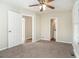 Spacious bedroom with en-suite bathroom and carpet flooring at 1603 Hollyhock Ter, Decatur, GA 30032