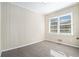 Cozy bedroom with wainscoting walls and carpet flooring at 1603 Hollyhock Ter, Decatur, GA 30032