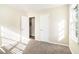 Bright bedroom with neutral walls and carpet flooring and closet at 1603 Hollyhock Ter, Decatur, GA 30032