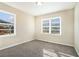 Well-lit bedroom with neutral walls and carpet flooring at 1603 Hollyhock Ter, Decatur, GA 30032