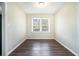 Simple dining room featuring wood-look flooring and large windows at 1603 Hollyhock Ter, Decatur, GA 30032