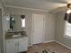 A small bathroom with sink, toilet and granite countertop at 2455 Lake Harbin Rd, Morrow, GA 30260