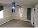 Bright bedroom with carpet flooring, ceiling fan, and access to bathroom at 2455 Lake Harbin Rd, Morrow, GA 30260