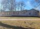 Back of house with additional sunroom and large backyard at 2455 Lake Harbin Rd, Morrow, GA 30260