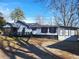 Ranch style home with a large yard and mature trees at 2455 Lake Harbin Rd, Morrow, GA 30260