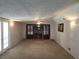 Large living room with fireplace and access to backyard at 2455 Lake Harbin Rd, Morrow, GA 30260