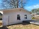 White storage shed with door and windows at 2455 Lake Harbin Rd, Morrow, GA 30260