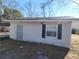 White storage shed with door and window at 2455 Lake Harbin Rd, Morrow, GA 30260