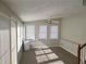 Sunroom with multiple windows and a ceiling fan at 2455 Lake Harbin Rd, Morrow, GA 30260