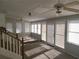 Spacious sunroom with multiple windows and a ceiling fan at 2455 Lake Harbin Rd, Morrow, GA 30260