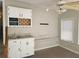 Home wet bar with white cabinets, granite countertop, and wine rack at 2455 Lake Harbin Rd, Morrow, GA 30260